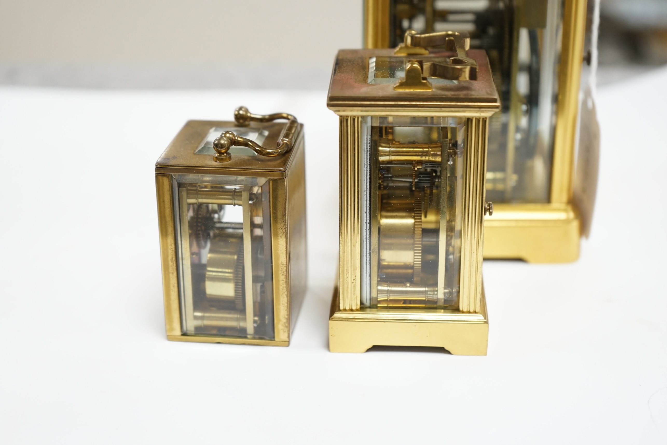 A French carriage clock and two other miniature carriage clocks, largest 13cm high. Condition - fair to good, not tested as working